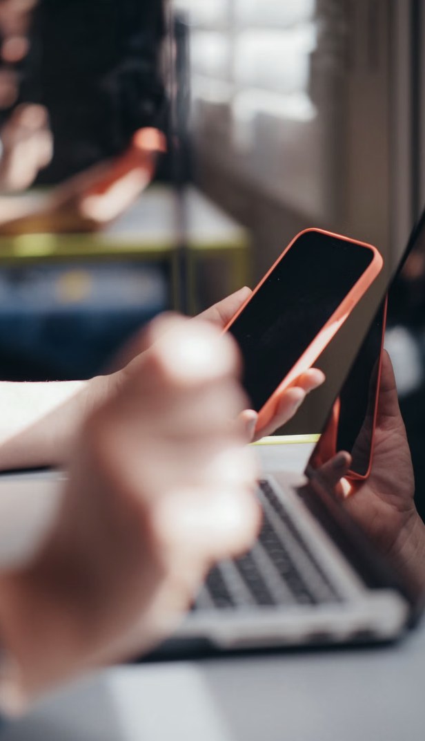People using communications across phones and a computer